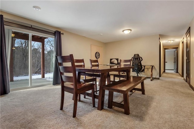 view of carpeted dining area