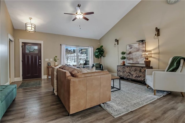 living room featuring lofted ceiling, dark hardwood / wood-style floors, and ceiling fan