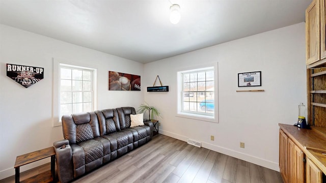 living room with light hardwood / wood-style floors