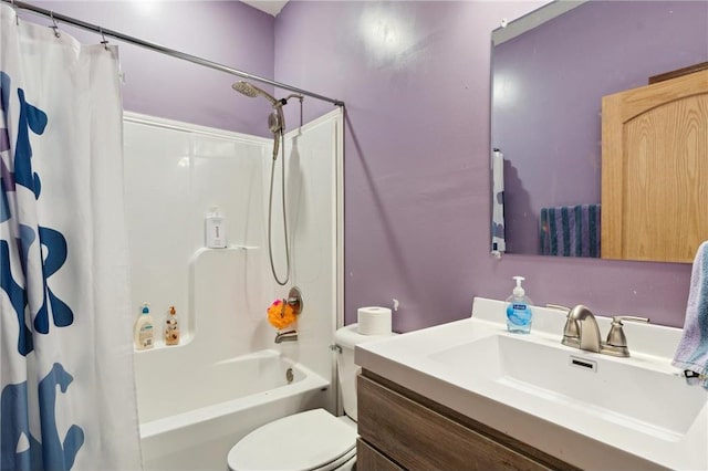 full bathroom featuring shower / bath combo, vanity, and toilet