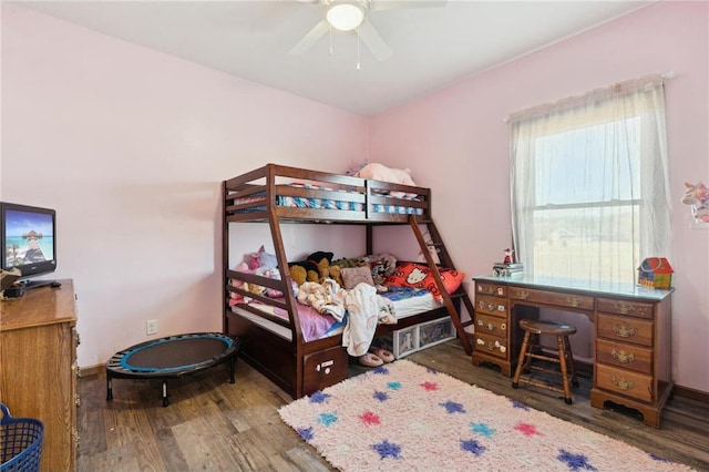 bedroom featuring wood-type flooring and ceiling fan