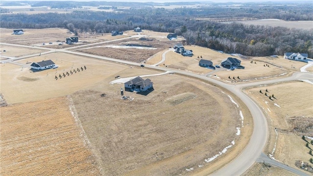 birds eye view of property featuring a rural view