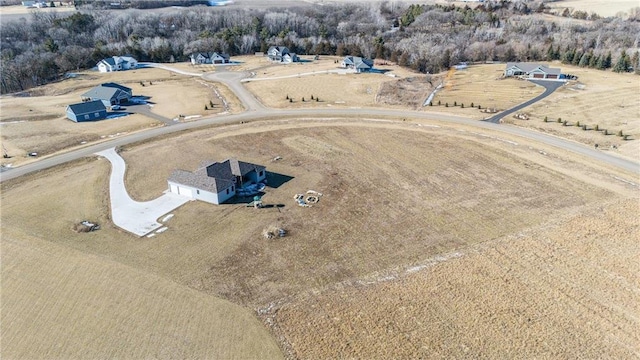 birds eye view of property with a rural view