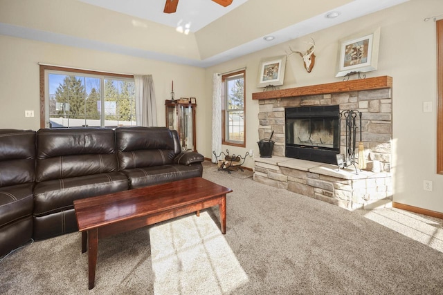 living room featuring ceiling fan, carpet flooring, and a fireplace