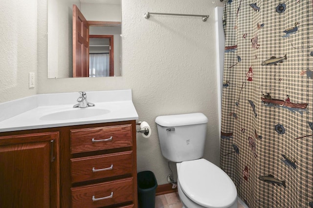 bathroom featuring vanity, toilet, and a shower with shower curtain