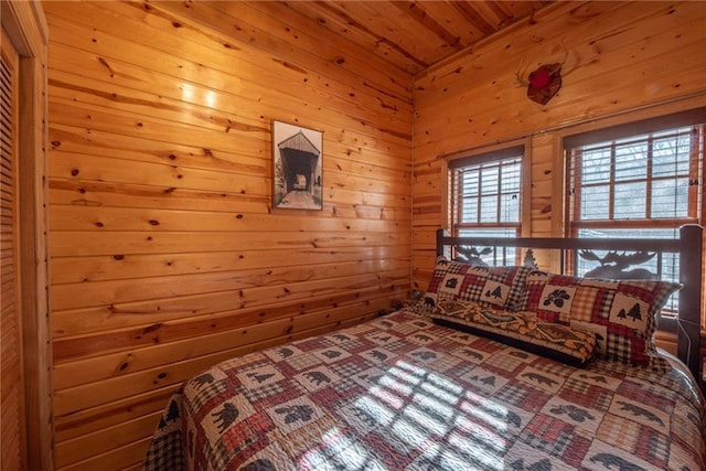 W268 County Highway A, Stone Lake, WI 54876 - bedroom featuring wood walls
