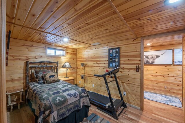 W268 County Highway A, Stone Lake, WI 54876 - bedroom with wood ceiling, wooden walls, and hardwood / wood-style flooring