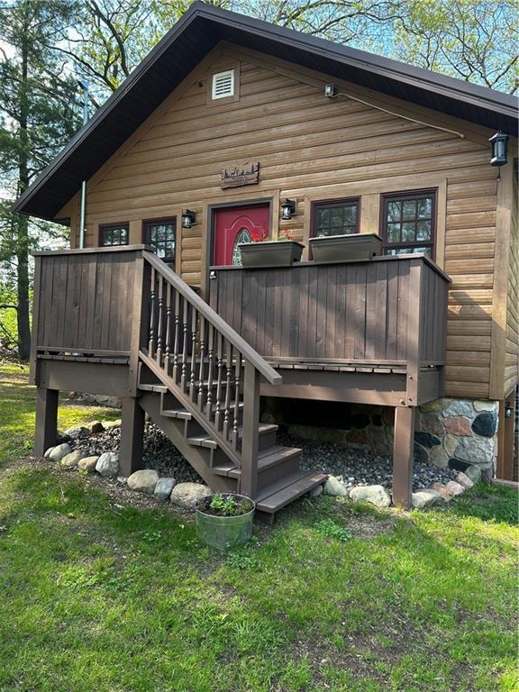 W268 County Highway A, Stone Lake, WI 54876 - rear view of property with a lawn and a deck