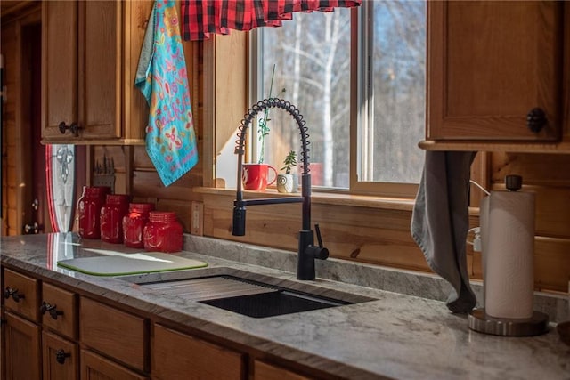 W268 County Highway A, Stone Lake, WI 54876 - kitchen featuring sink and light stone counters