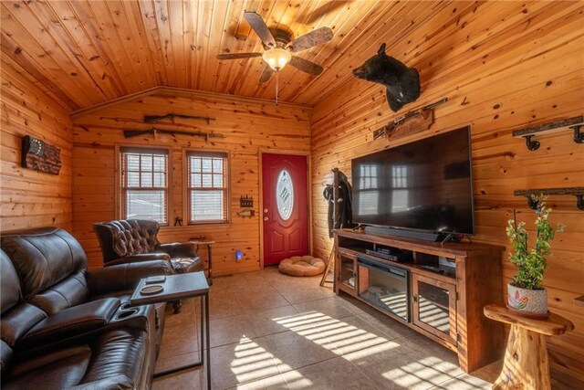 W268 County Highway A, Stone Lake, WI 54876 - tiled living room featuring lofted ceiling, wood ceiling, ceiling fan, and wood walls