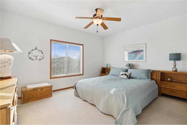 bedroom with light carpet and ceiling fan