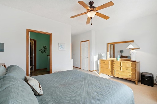 bedroom with light colored carpet and ceiling fan