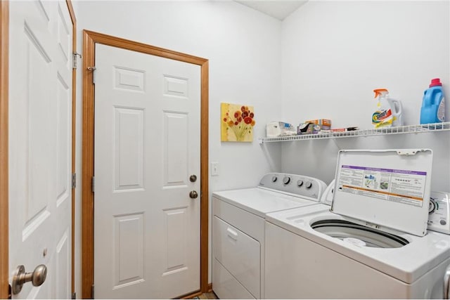 laundry room featuring separate washer and dryer