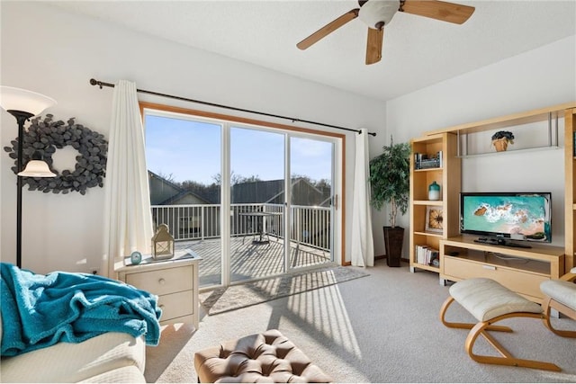 living room with light carpet and ceiling fan