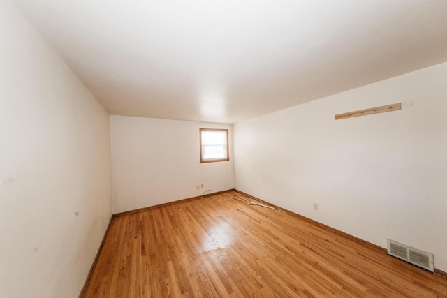 empty room featuring hardwood / wood-style floors