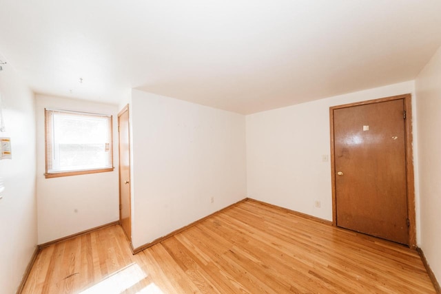 unfurnished room featuring light hardwood / wood-style floors