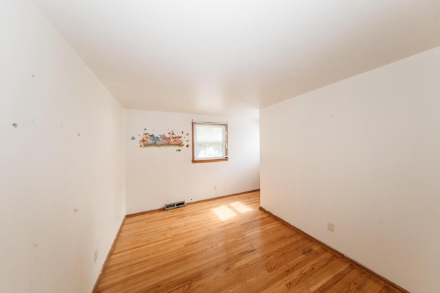 unfurnished room featuring light hardwood / wood-style flooring