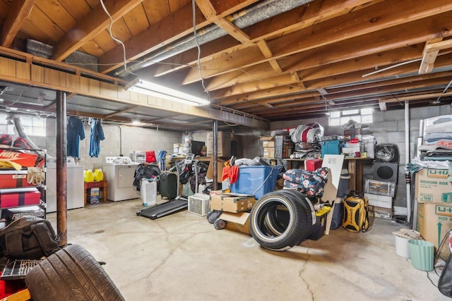 basement featuring washing machine and clothes dryer