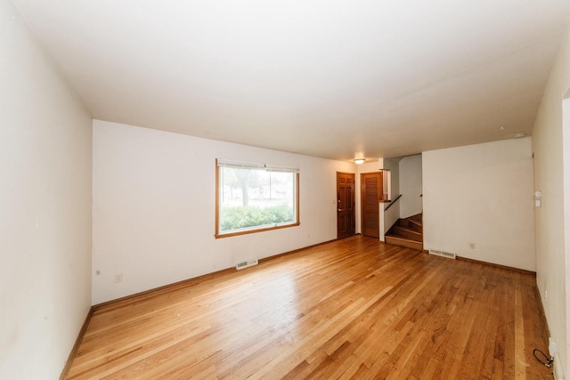 unfurnished room featuring light hardwood / wood-style floors