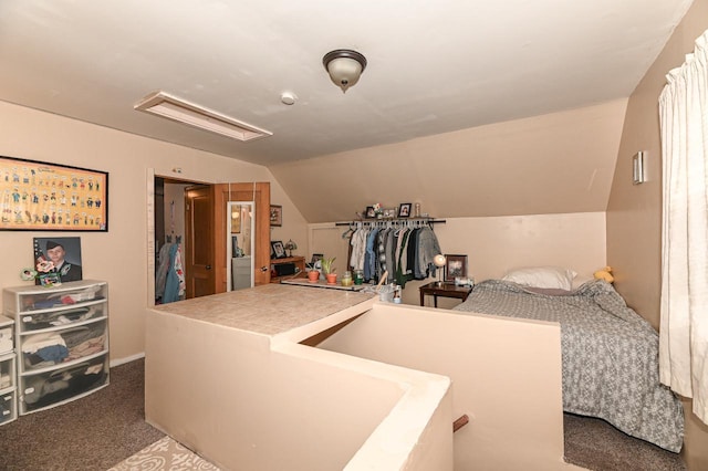 bedroom featuring carpet floors and vaulted ceiling