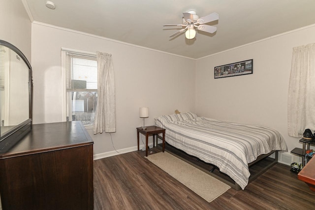 bedroom with crown molding, dark wood-type flooring, and ceiling fan