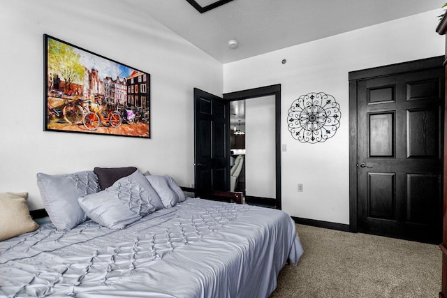 carpeted bedroom featuring lofted ceiling