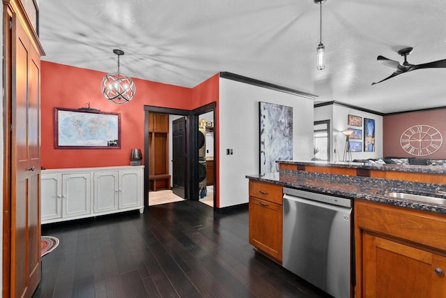 kitchen featuring dark wood-type flooring, ceiling fan, decorative light fixtures, stainless steel dishwasher, and dark stone counters