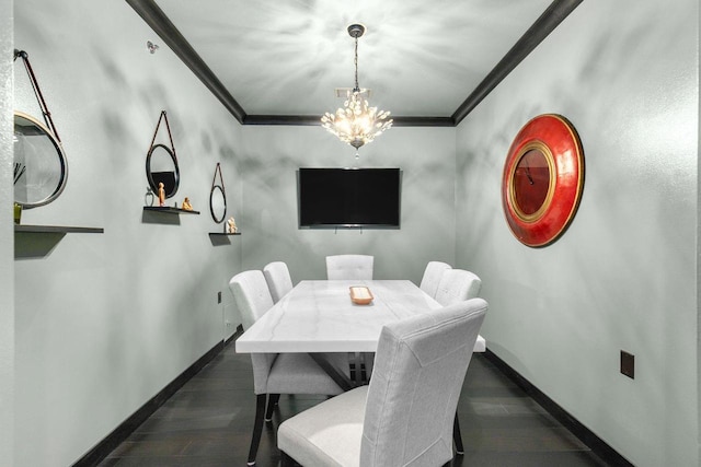 dining space with ornamental molding, dark hardwood / wood-style floors, and an inviting chandelier