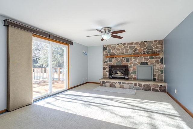 401 E Riverside Ave, Merrill, WI 54452 - unfurnished living room with light carpet, a fireplace, and ceiling fan