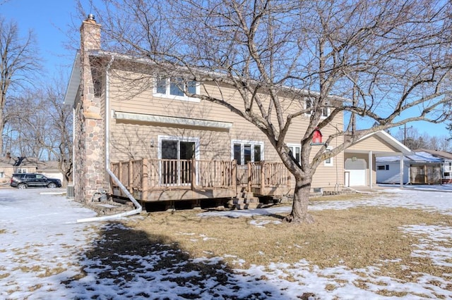 401 E Riverside Ave, Merrill, WI 54452 - snow covered house with a deck