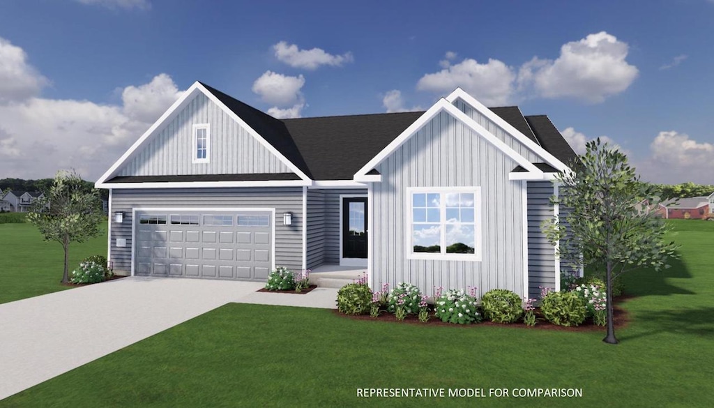 view of front of home featuring a garage and a front lawn