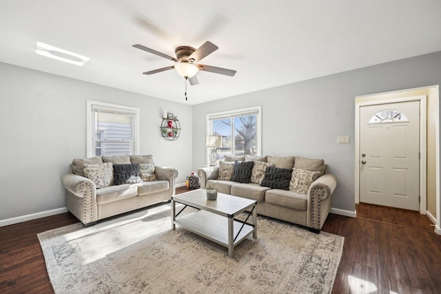 living room featuring dark hardwood / wood-style floors and ceiling fan