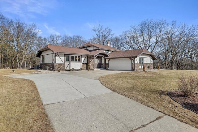 view of front of house with a garage and a front yard