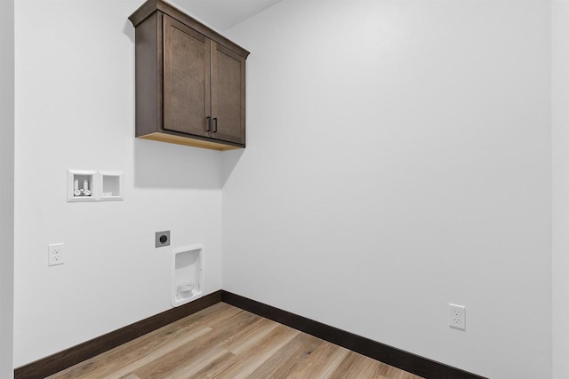 laundry area with washer hookup, cabinets, light hardwood / wood-style flooring, and hookup for an electric dryer