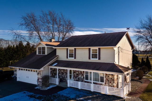 view of front of home with a garage and covered porch