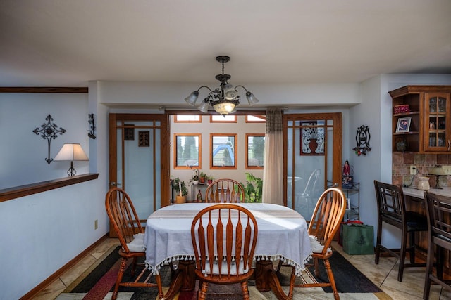 dining space featuring an inviting chandelier