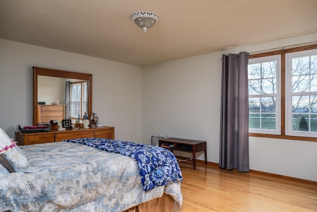 bedroom with light wood-type flooring