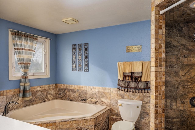 bathroom featuring plus walk in shower, tile walls, and toilet