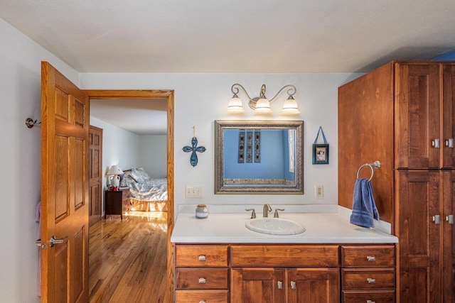 bathroom featuring vanity and hardwood / wood-style floors