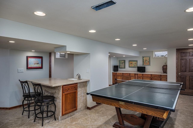 game room featuring indoor wet bar