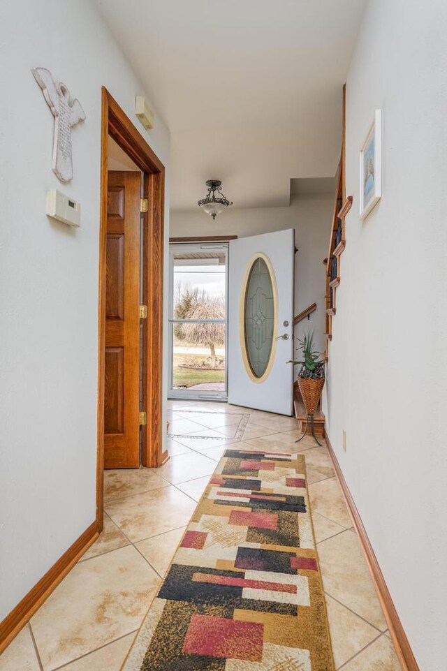 entryway featuring light tile patterned floors