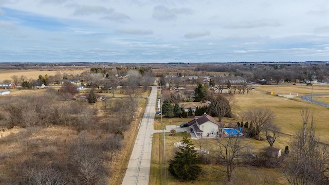 birds eye view of property with a rural view