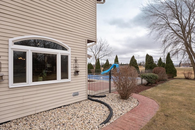 exterior space with a pool, a yard, and a patio area