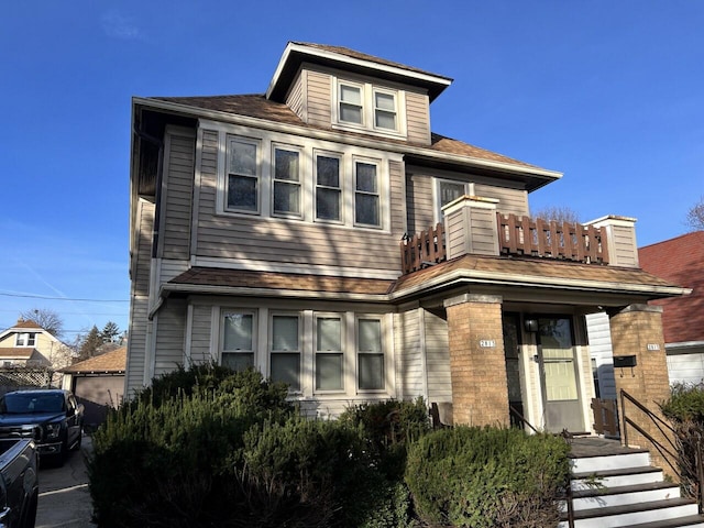 view of front of home with a balcony