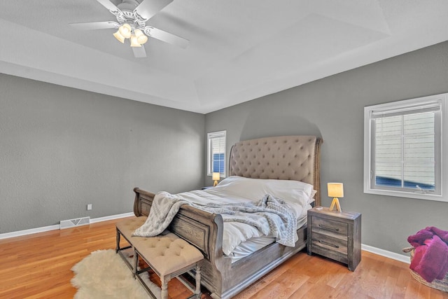 bedroom featuring wood-type flooring and ceiling fan