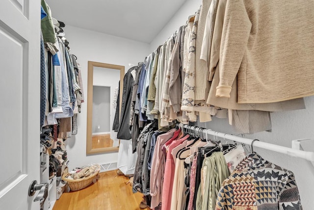 walk in closet featuring hardwood / wood-style flooring