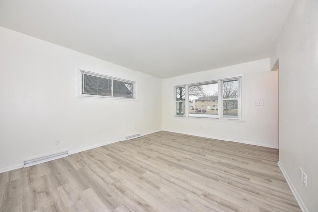 unfurnished room featuring light hardwood / wood-style floors