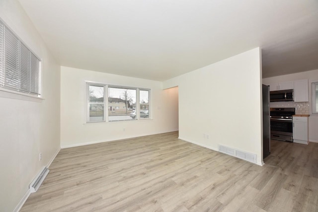 unfurnished room featuring light hardwood / wood-style flooring