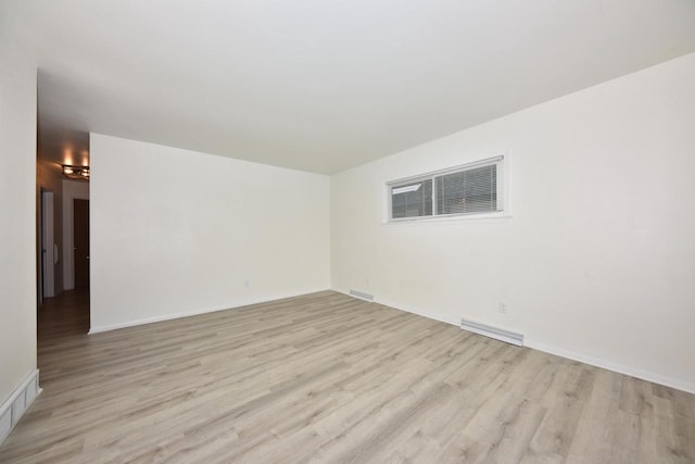 spare room with light wood-type flooring