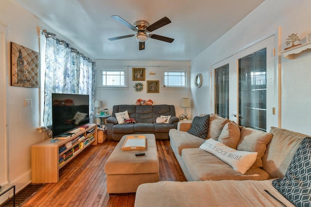 living room with wood-type flooring, french doors, and ceiling fan